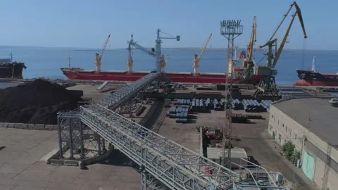 Loading of a merchant ship in port with grain using a belt gallery Stock Footage 147732092