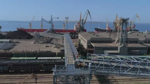Loading of a merchant ship in port with grain using a belt gallery Stock Footage 147732198