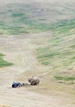 Loading mown hay Stock Photos