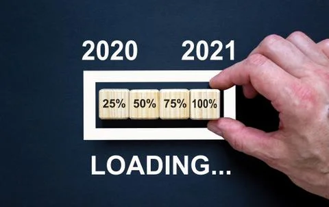 Loading new year 2021 with hand putting wood cube in progress bar. Business c Stock Photos