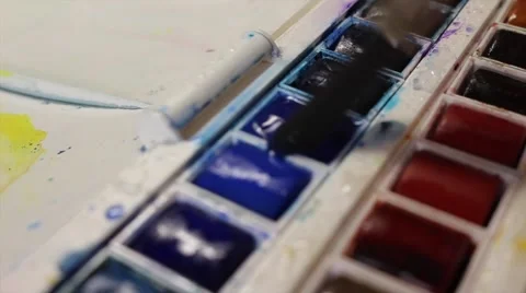 Loading Paintbrush with Watercolor Paint (Half pan) Stock Footage 62766061