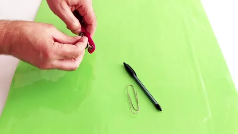 Loading Paper Clips into a Stapler-Unexpected Results Stock Footage 316806189