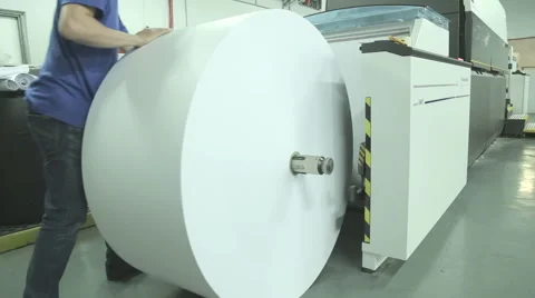 Loading paper into industrial inkjet printer Stock Footage 63512639