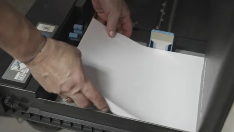 Loading Paper into Office Printer for Daily Business Workflow 動画素材 338171649