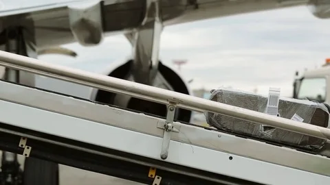 Loading of passenger baggage into the plane Stock Footage 82311001
