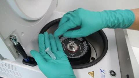 Loading a Pharmaceutical Centrifuge Apparatus Stock Footage 290298669