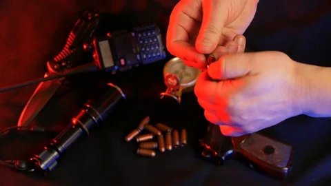 Loading pistol cartridge with bullets. Close Up. Stock Footage 89671314