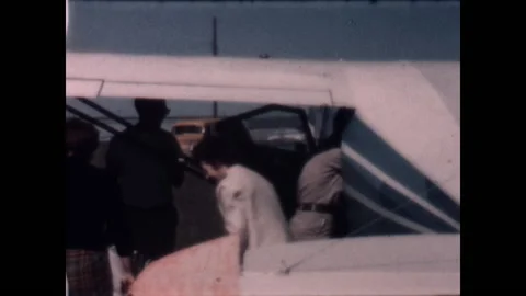 Loading the Plane 1957 Stock Footage 213784663