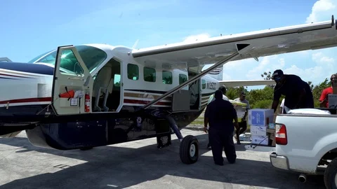 Loading a Plane with Relief Supplies (co) Video stock 116683626