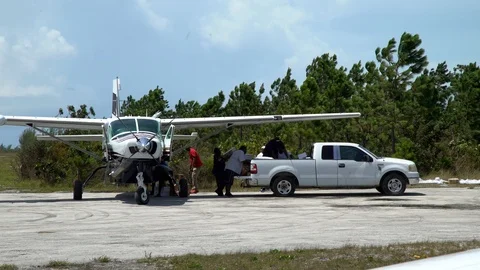 Loading a Plane with Supplies  (co) Stock Footage 116683608
