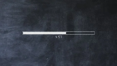 The loading process is shown in white on a chalkboard. Stock Footage 292103798
