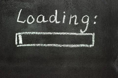 The loading process is shown in white on a chalkboard. Stop motion animation Stock Photos