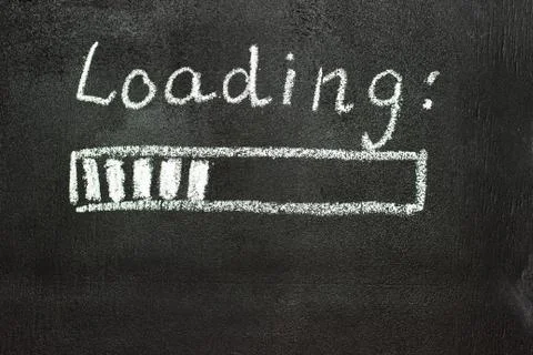 The loading process is shown in white on a chalkboard. Stop motion animation Stock Photos