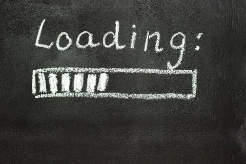 The loading process is shown in white on a chalkboard. Stop motion animation Stock Photos