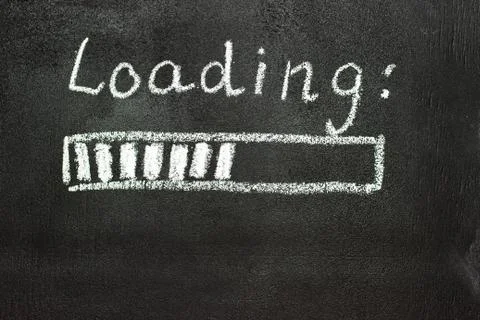 The loading process is shown in white on a chalkboard. Stop motion animation Stock Photos