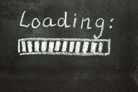 The loading process is shown in white on a chalkboard. Stop motion animation Stock Photos