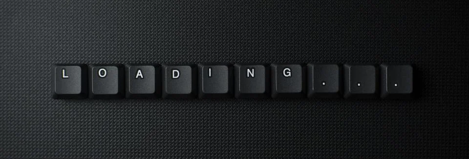 Loading Progress Message With Keyboard Keys On Dark Background Stock Photos