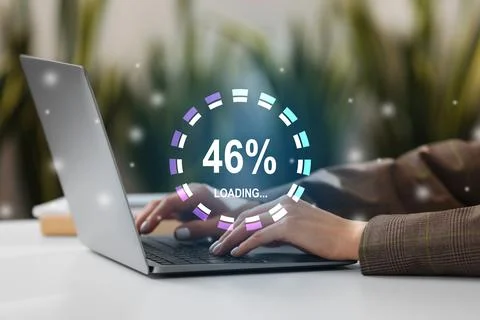 Loading progress. Woman working on laptop at table indoors, closeup Foto stock