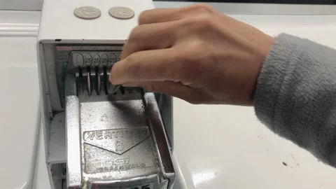 Loading Quarters into the slot machine. Stock Footage 141164329