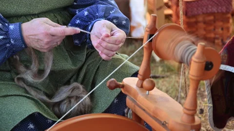 Loading Raw Wool Onto a Bobbin Spool Stock Footage 217397410