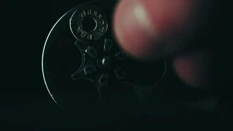 Loading a revolver chamber Stockbeeldmateriaal 337169415