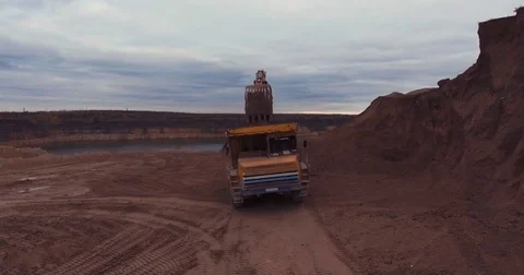 Loading sand excavating in heavy trucks Flight to drone Stock Footage 71282229