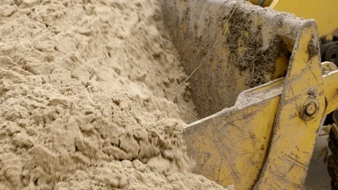 Loading sand powerful bucket machinery Stock Footage 90930780