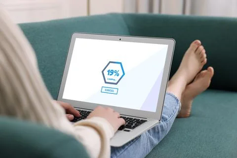Loading screen displaying progress. Woman working on laptop indoors, closeup Fotos de archivo