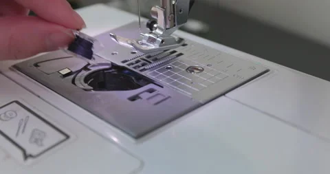 Loading A Sewing Machine Stock Footage 136782953