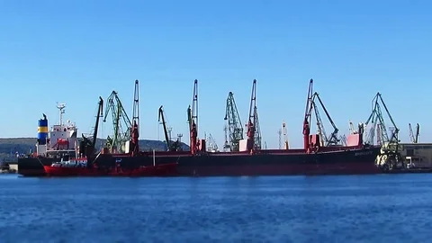 Loading a ship with cranes Stock Footage 80934405