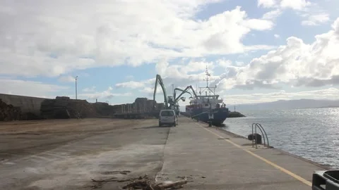 Loading a ship in the port of Burela Stock Footage 237526897