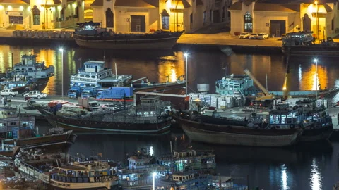 Loading a ship in Port Said night timelapse in Dubai, UAE. Video stock 90662408