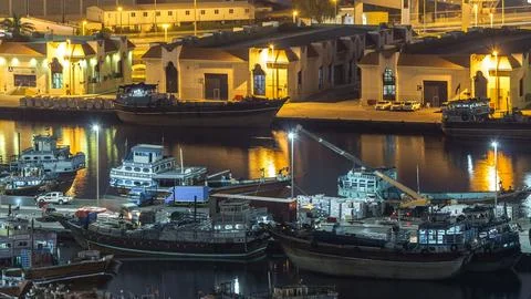 Loading a ship in Port Said night timelapse in Dubai, UAE. Foto stock