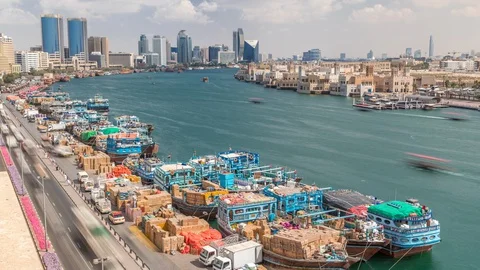 Loading a ship in port timelapse in Dubai, Deira creek, UAE. Video stock 129817910