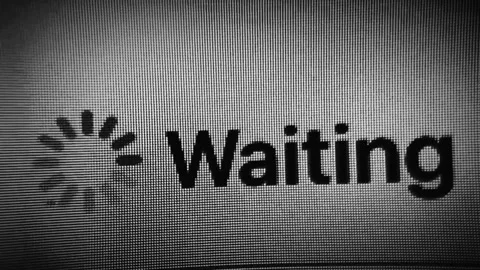 Loading spinner and the word waiting on a digital screen Stock Footage 336442904
