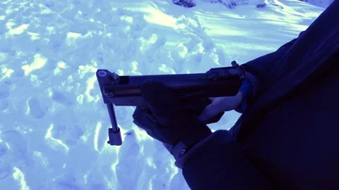 Loading a sport air gun in the winter outdoors Stock Footage 297779694