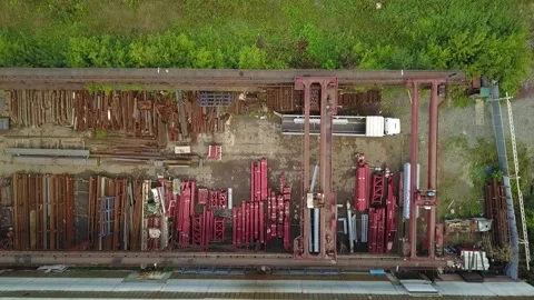 Loading steel into a truck using a crane beam Stock Footage 139601854