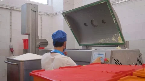 Loading sugar into a mixing machine Stock Footage 161510479