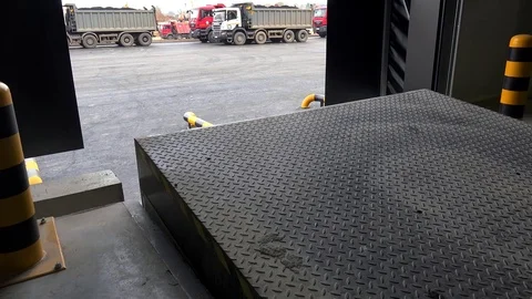 Loading technology in the warehouse. Sectional  door &amp;  Dock Leveller systems. Video stock 72072966