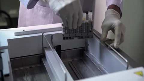 Loading Test Tubes into the Machine 2 Video stock 287964277