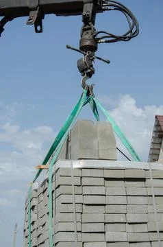 Loading tiles to the ground from a car. Delivery and unloading of building ma Stock Photos