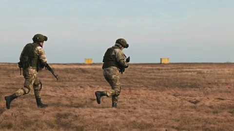 Loading troops into the transport cabin of an attack helicopter. Multi-purpose Video stock 172651132
