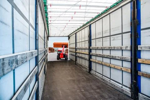Loading the Truck. Forklift loading a Trailer . Stock Photos