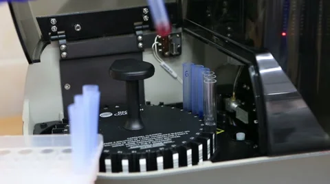 Loading tubes in the flow cytometer Stock Footage 60608629