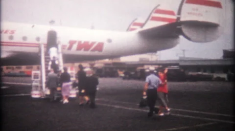 Loading TWA passenger plane, then take off 1950s vintage film home movie 3317 Stock Footage