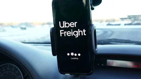 Loading Uber Freight on a Smartphone While Driving Stock Footage 146561277