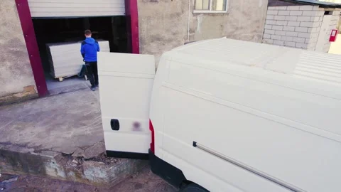 Loading the van with wooden things at the carpentry Stock Footage 273707025