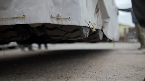Loading vehicle onto transport platform Stock Footage 311592653
