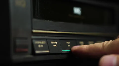 Loading VHS Tape and Pressing Plat on VCR, Close Up Selective Focus Vídeos de archivo 295919792
