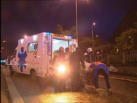 Loading victim in ambulance Stock Footage 637576